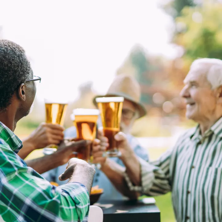  group-of-senior-friends-drinking-a-beer