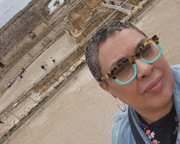 Photo of Maria in front of historic site