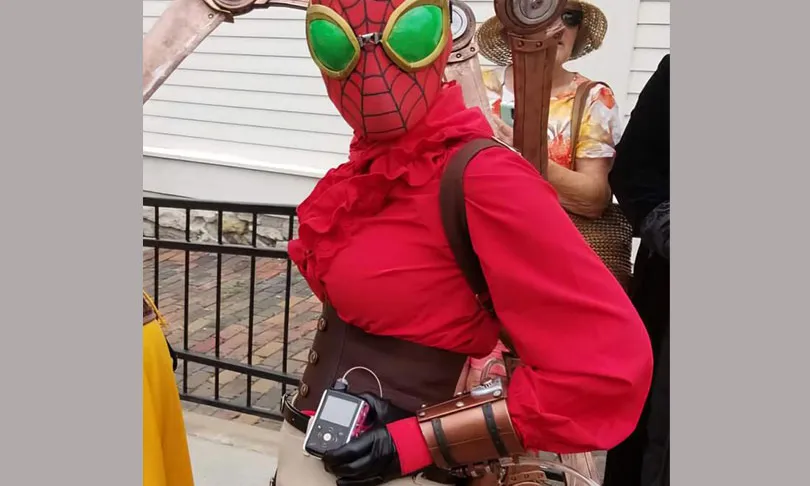 A person dressed as Steampunk Spider-Man with insulin pump