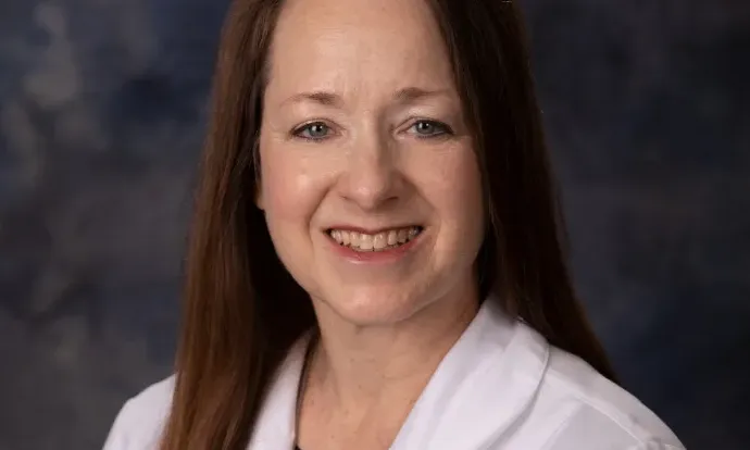 Photo of woman in white coat