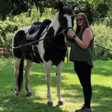 Alysa standing with her horse