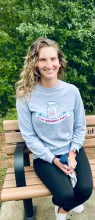 Photo of Bryanna sitting on a bench