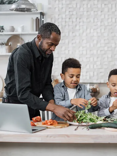 multinational mom and dad enjoying healthy cooking